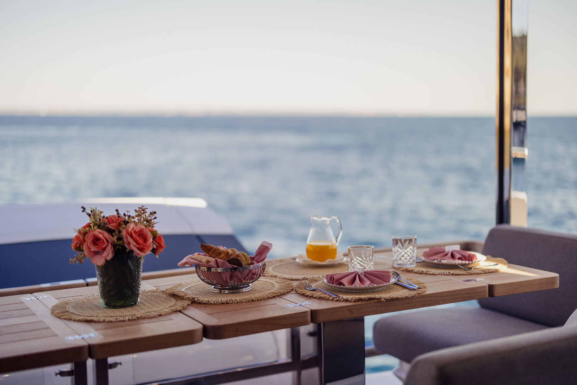 Breakfast table setting at sea aboard M/Y Lio Black Knight Sunseeker 95 — luxury charter dining