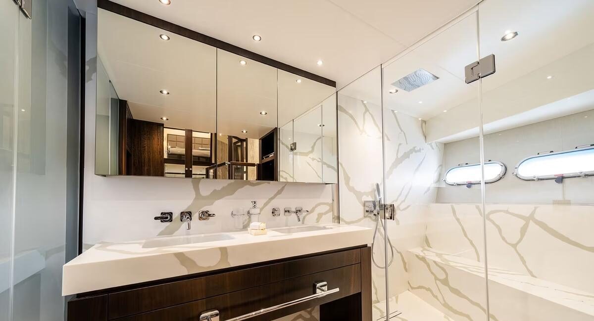 M/Y Lio Black Knight Sunseeker 95 guest en-suite bathroom — luxury yacht charter accommodation